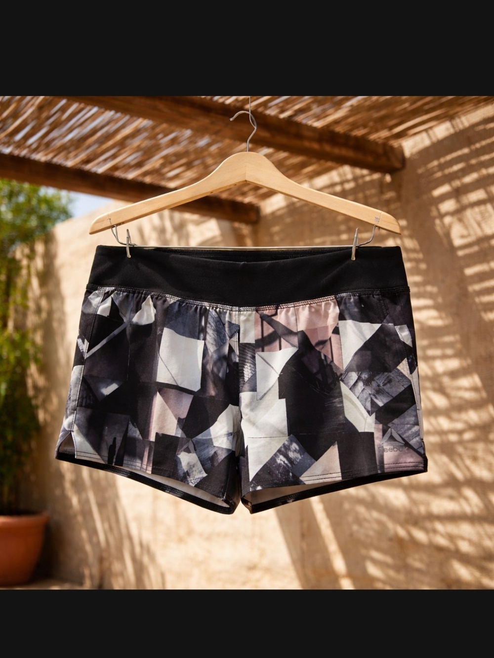 Reebok Black Geometric Print Athletic Shorts with Pink Accents